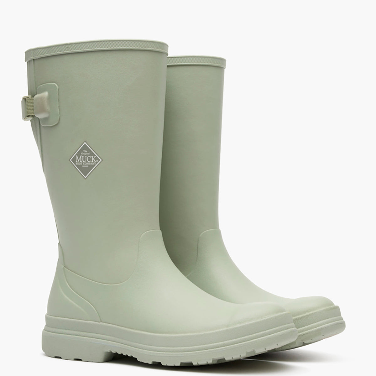 Pair of light green rubber boots on a white background