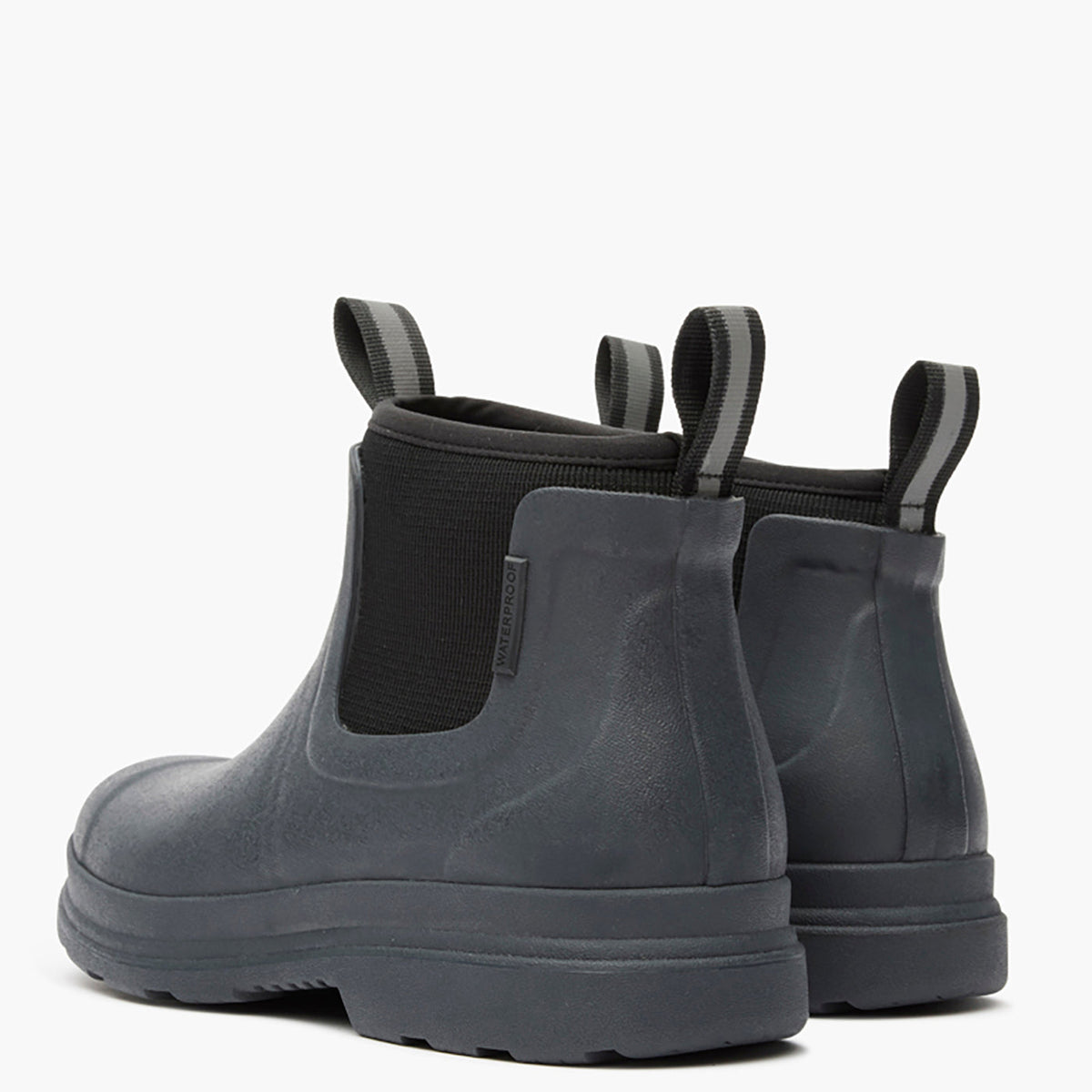 Pair of gray rubber boots with elastic sides on a white background